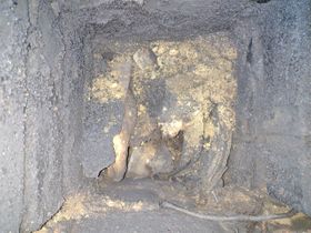 Looking down the chimney, the flue failure (caused by incorrect fuels used, age of liner, and lack of sweeping), mortar failure and excessive soot blocked the flue. A smoke test showed an open flue, but camera footage and inspection from above showed the real extent of the deterioration and dangers.